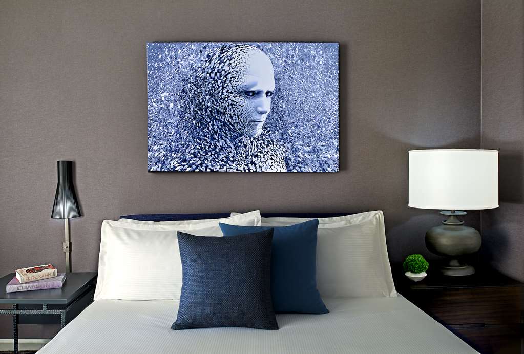 Hotel Zelos San Francisco Bed and Artwork in the Deluxe King Guestroom