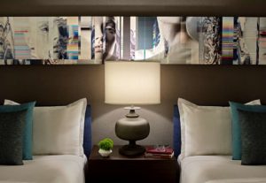 Hotel Zelos San Francisco Beds and Side Table in the Deluxe Double Guestroom