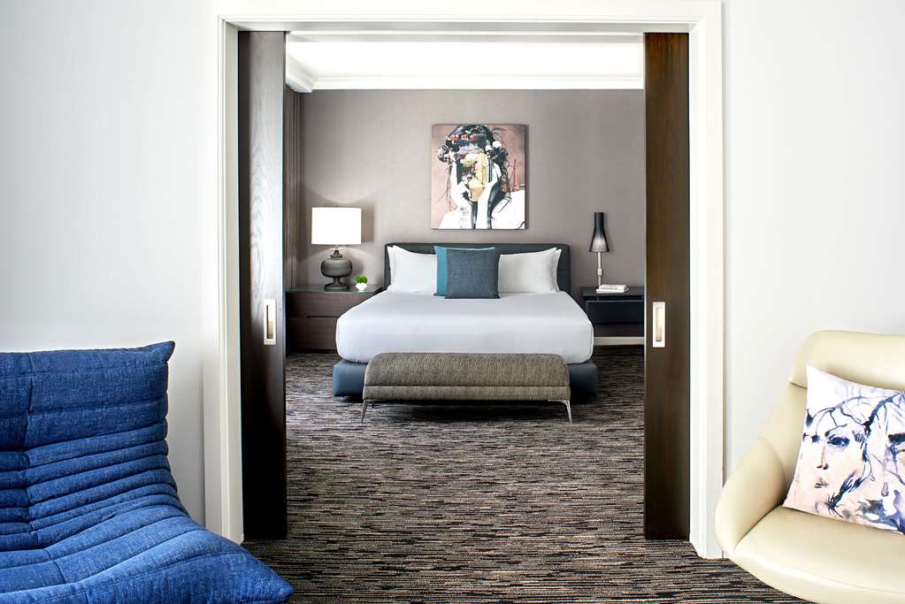 Hotel Zelos San Francisco Hotel Zelos Deluxe Suite bedroom and living area.