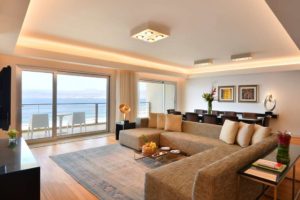 Kempinski Hotel Aqaba Royal Suite Living room space wit view of the Red Sea.