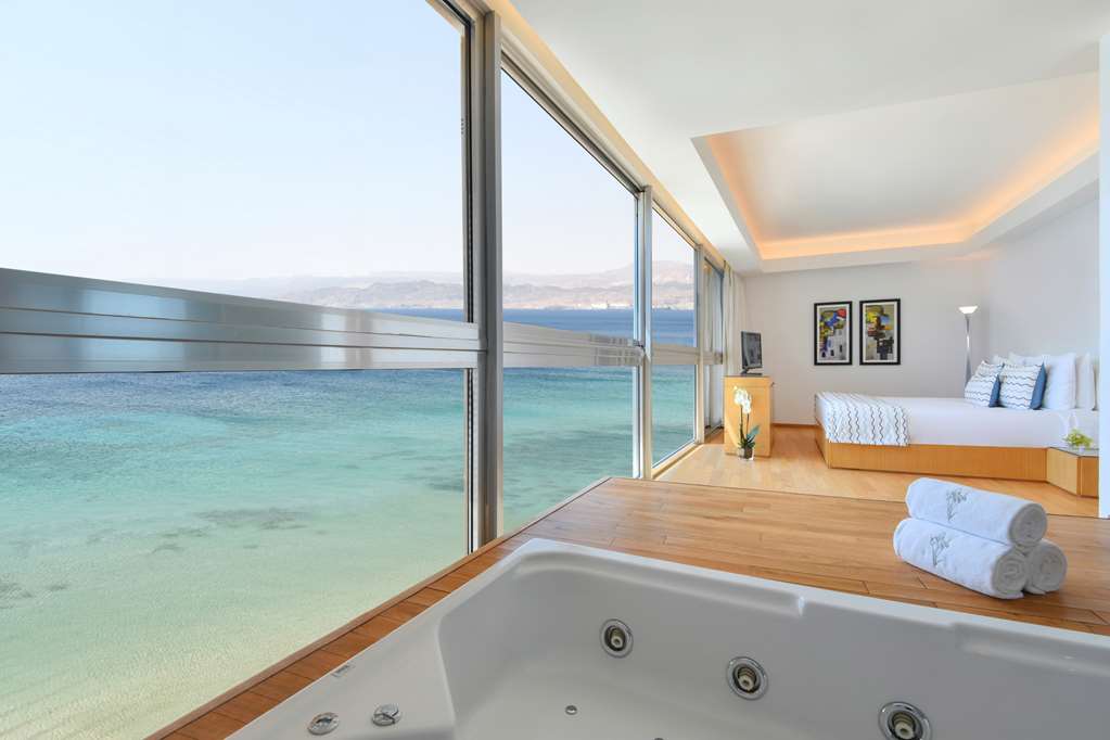 Kempinski Hotel Aqaba Executive Panormic Suite whirlpool in bedroom with views of the Red Sea.