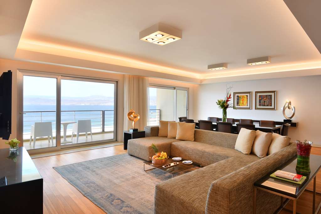 Kempinski Hotel Aqaba Royal Suite Living room space wit view of the Red Sea.