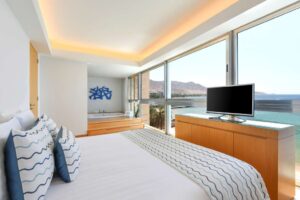 Kempinski Hotel Aqaba Executive Panormic Suite bedroom and whirlpool with a view.