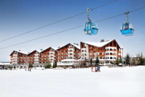 Kempinski Hotel Grand Arena Bansko Bulgaria SOF2_Kempinski Bansko_Hotel back facade and Gondola lift.jpg