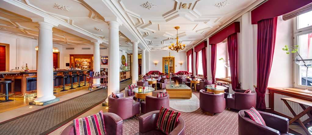 Kempinski Grand Hotel des Bains St.Moritz Kempinski Bar Tables 2 Wide.jpg